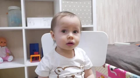 Child asks for something, is nervous, stretches out his hands and cries Stock Footage 257677943