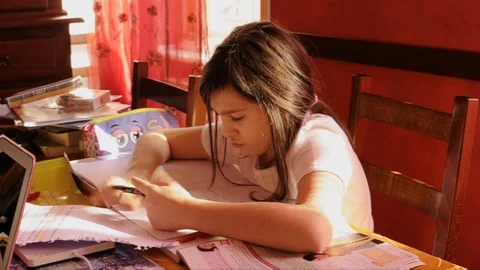 Child with Asperger's Syndrome has difficulty performing homework Stock Footage 87499848