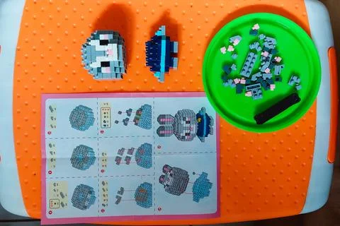 Child assembling creative Lego mini character toy Stock Photos