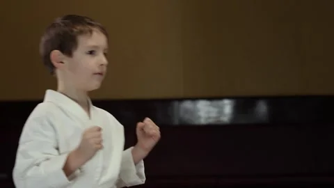 Child athlete doing exercise raising legs to arms Stock Footage 301507287