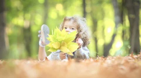 Child in autumn park Stock Footage