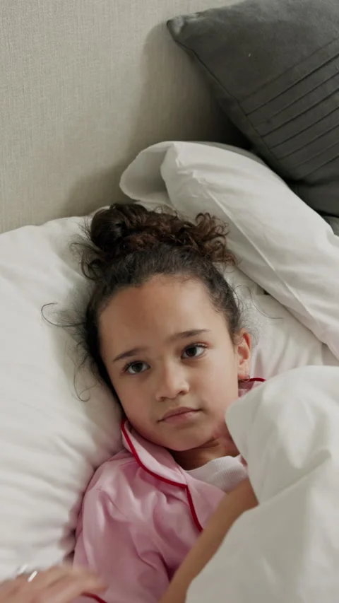 Child, awake and breakdown with anger in bed for attitude, ADHD or discipline in Stock Footage 338109240