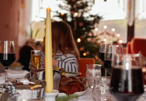 Child in the background at the set dining table at Christmas time Stock Photos