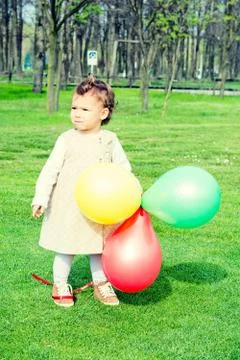 Child with balloons Stock Photos