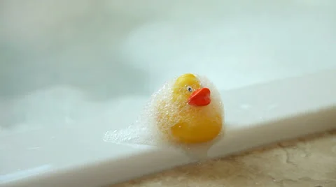 Child in bath with rubber duckie Stock Footage