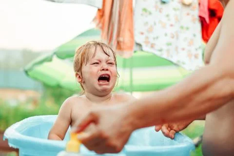 The child is bathed in a bath Stock Photos