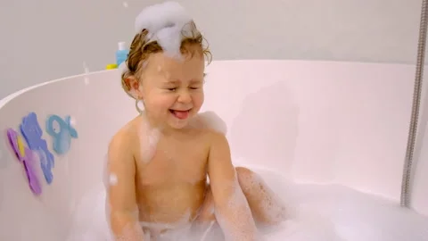 A child bathes in a bubble bath. Selective focus. Stock Footage 234604351