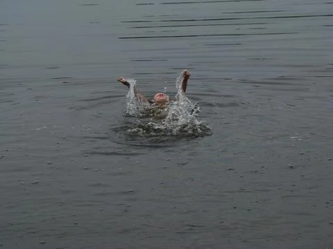 Child is bathing in the river Stock Photos