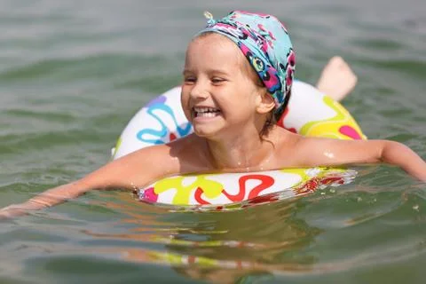 Child bathing in the sea Stock Photos