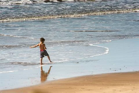 Child on the beach Stock Photos