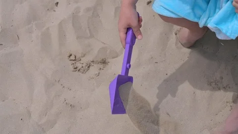Child on the beach plays Stock Footage 114580602