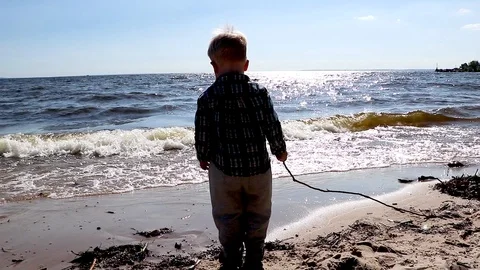 Child on the beach. Super hero kid having fun outdoor. Summer vacation concept Stock Footage 90094855