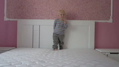A child in bed on a mattress Video stock 235823411