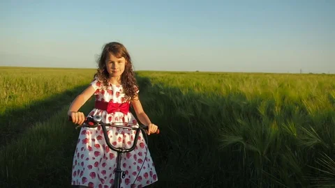 Child with a bicycle outdoors. Stock Footage
