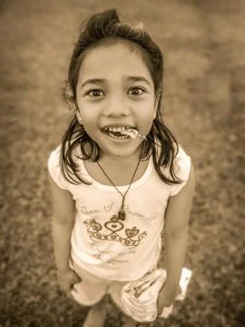 Child-Biting-Candy Stock Photos