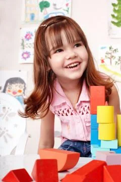 Child with  block and construction set in play room. Stock-Fotos