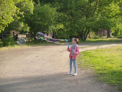 Child blow bubbles Stock Photos