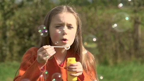 Child Blowing Bubbles Stock-Footage 88507673