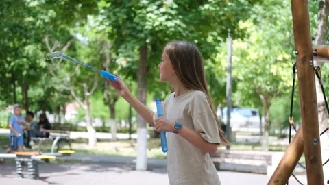 A child blows soap bubbles. Stock Footage 277540702