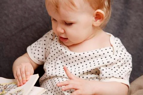 Child with a book Stock Photos