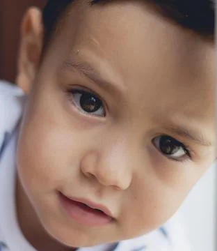 Child boy on close-up looking to the camera 스톡 사진