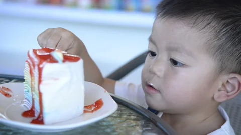 Child Boy eating Cake in the coffee shop Stock Footage 99296906