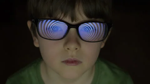 Child Boy With Glasses Watching Hypnotic Screen. Influence of Media on Peop.. Stock Footage 329454764