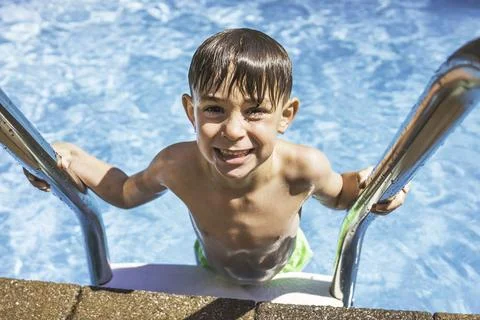 Child boy having fun in Pool on the summer time Stock-Fotos