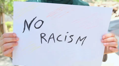 Child boy hold a paint for support no racism movement,no racism,education kids Stock Footage 137759791