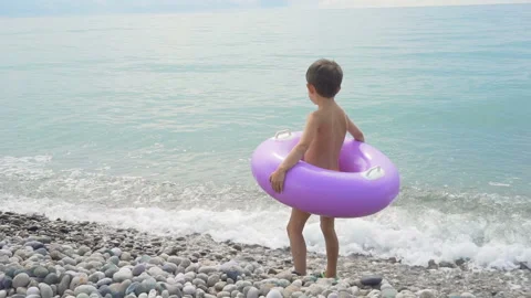 Child boy with inflatable ring ready to swim Stock Footage 95798118