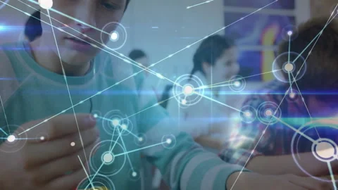 Child boy inserting wire into circuit board with classmate typing code animating Stock Footage 313148195