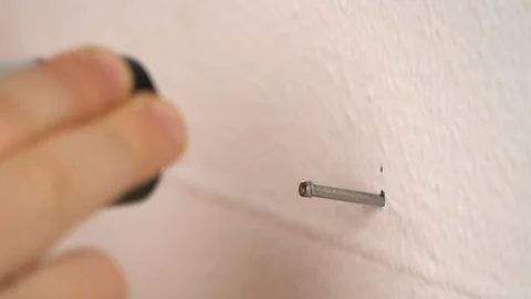 Child (boy) is learning work with nail and hammer Stock Footage 127148631