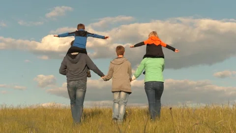 Child boy mother father back. concept children dream fly. family couple park Stock Footage 201408048
