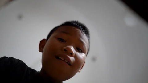 Child boy open a gift, look inward and rejoice, the view from inside the gift Video stock 113285975