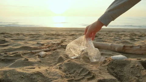 Child boy pick up plastic bottle from dirty sea ecosystem,environment pollution Stock Footage 230736273