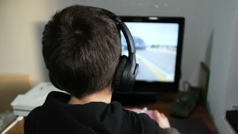 Child boy playing console game on console at home,kids videogames addiction Stock Footage 148349878