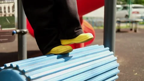 Child boy is running on the simulator of trainer, look like drum treadmill at Stock Footage 312515542