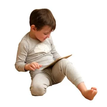 Child boy sitting on floor using digital tablet computer. Toddler playing mob Fotos Stock