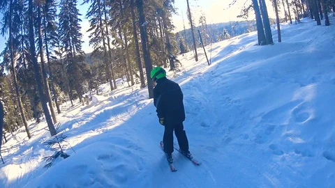 Child boy skiing through forest. Stockbeeldmateriaal 86281195