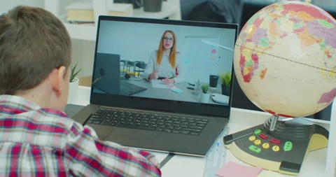 Child boy studying homework during his online lesson at home, social distance Stock Footage 148725941