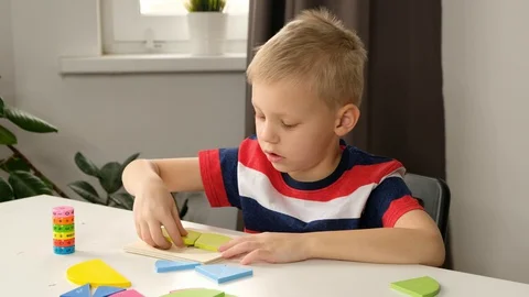 Child boy toddler doing simple math exercises with fractions at school, close up Stock Footage 128203820