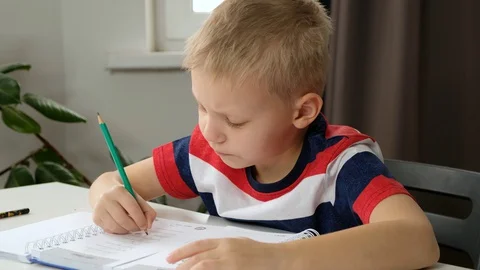 Child boy toddler hand doing simple math exercises, close up. Mathematics Stock Footage 128203468