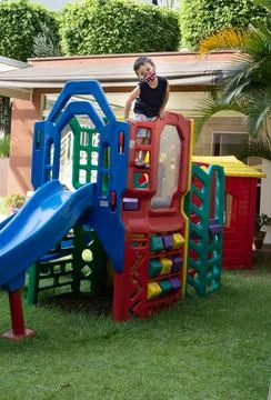 Child boy using a mask playing on a playground Stock Photos