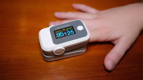 Child boy using pulse oximeter for oxygen blood saturation exam,covid19 pandemic Stock Footage 147152167