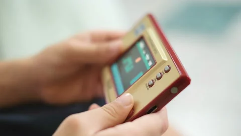 Child boy while playing with portable videogames console,tech kids addiction Stock Footage 156601202
