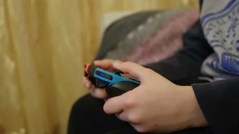 Child boy while playing with portable videogames console,tech kids addiction Stock Footage 168110004