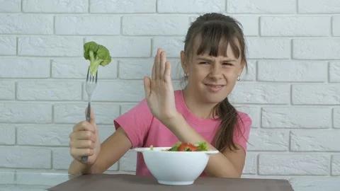 Child with broccoli. Stock Footage 116385204