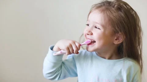 Child brush their teeth. dental hygiene. happy little girl Stock Footage