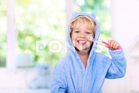 Child brushing teeth. Kids tooth brush. Stock Photos