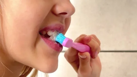 Child brushing teeth with a toothbrush, close-up Stock Footage 291682556